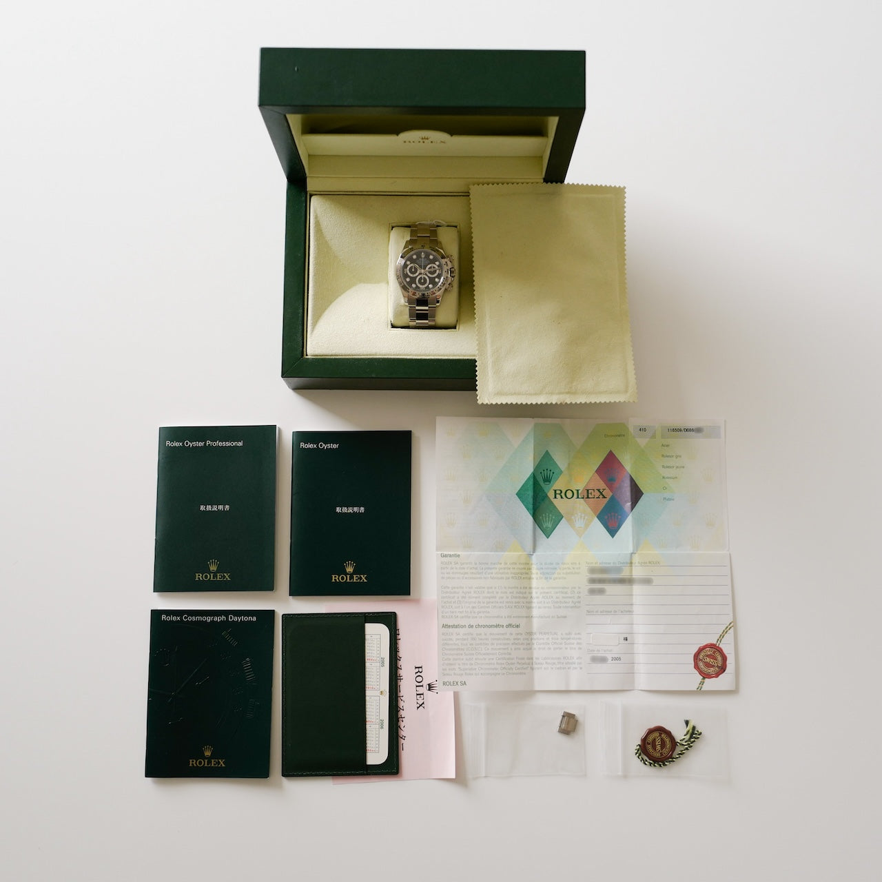 ロレックス/デイトナ116509/8Pダイヤ/18KWG/D番2005年/ROLEX DAYTONA Ref.116509 D 2005y With Paper